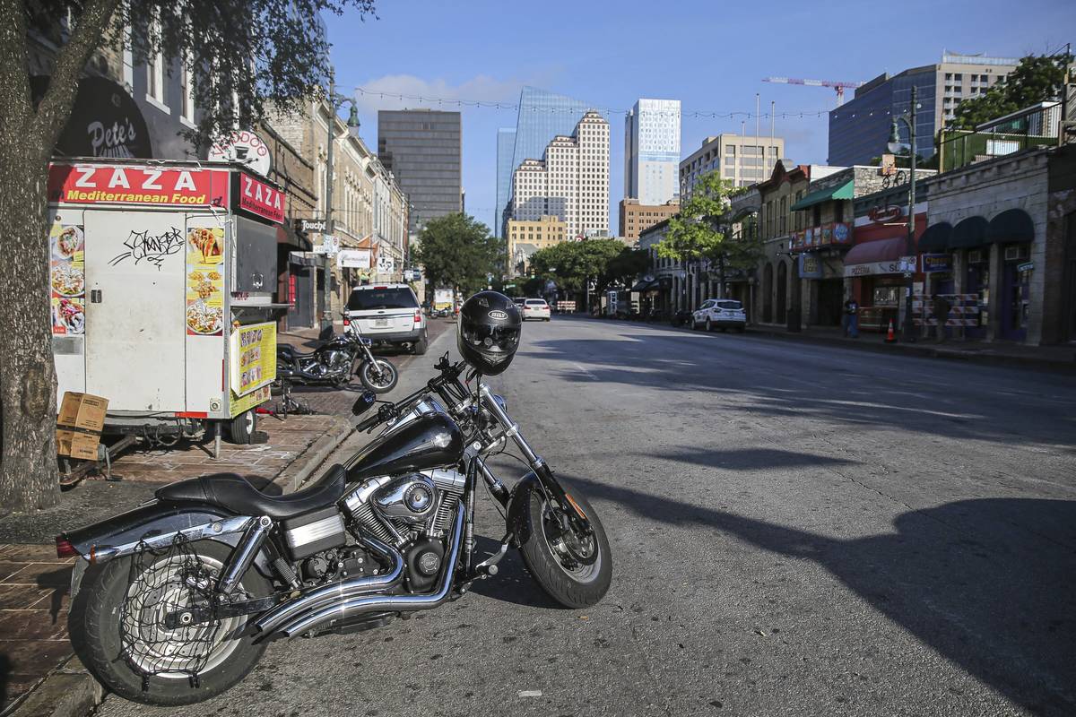 Some abandoned bikes are parked on the streets after a early morning shooting on Saturday, June ...