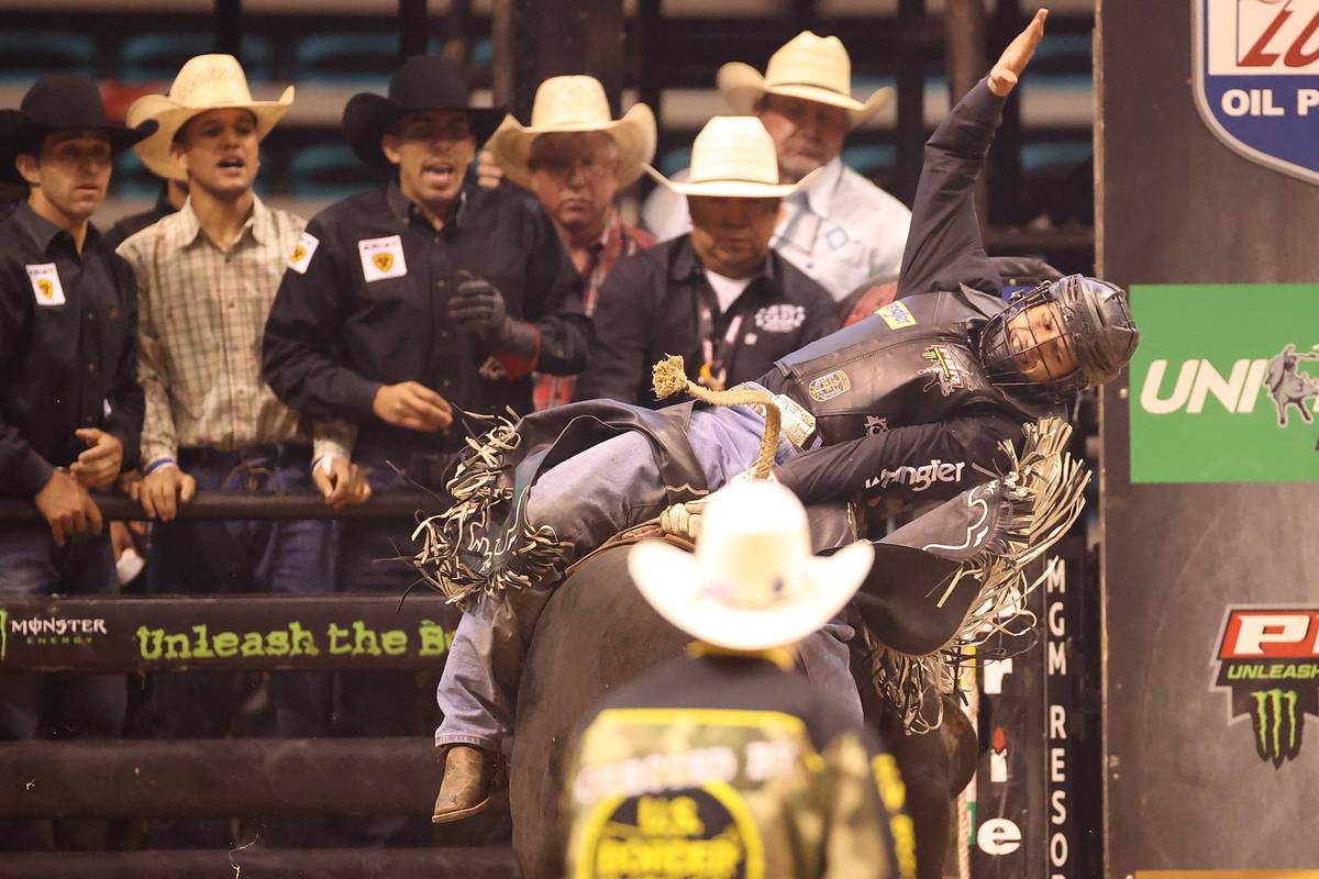 Bull rider Dener Barbosa competes during the Professional Bull Riders Las Vegas Invitational at ...