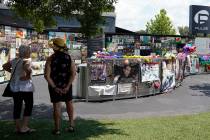 Visitors pay tribute to the display outside the Pulse nightclub memorial Friday, June 11, 2021, ...