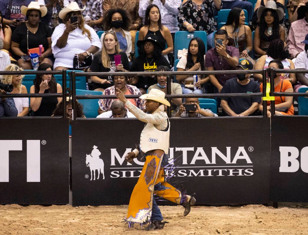 Harold Miller, of Liberty S.C., reacts after completing the bareback riding competition at the ...