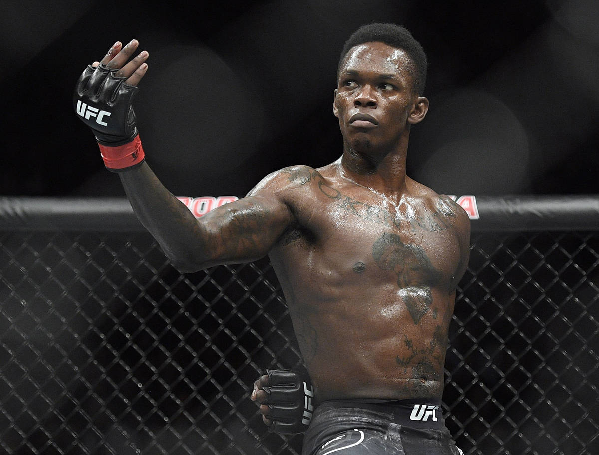 FILE - In this Feb. 10, 2019, file photo, Nigeria's Israel Adesanya poses as he fights Brazil's ...