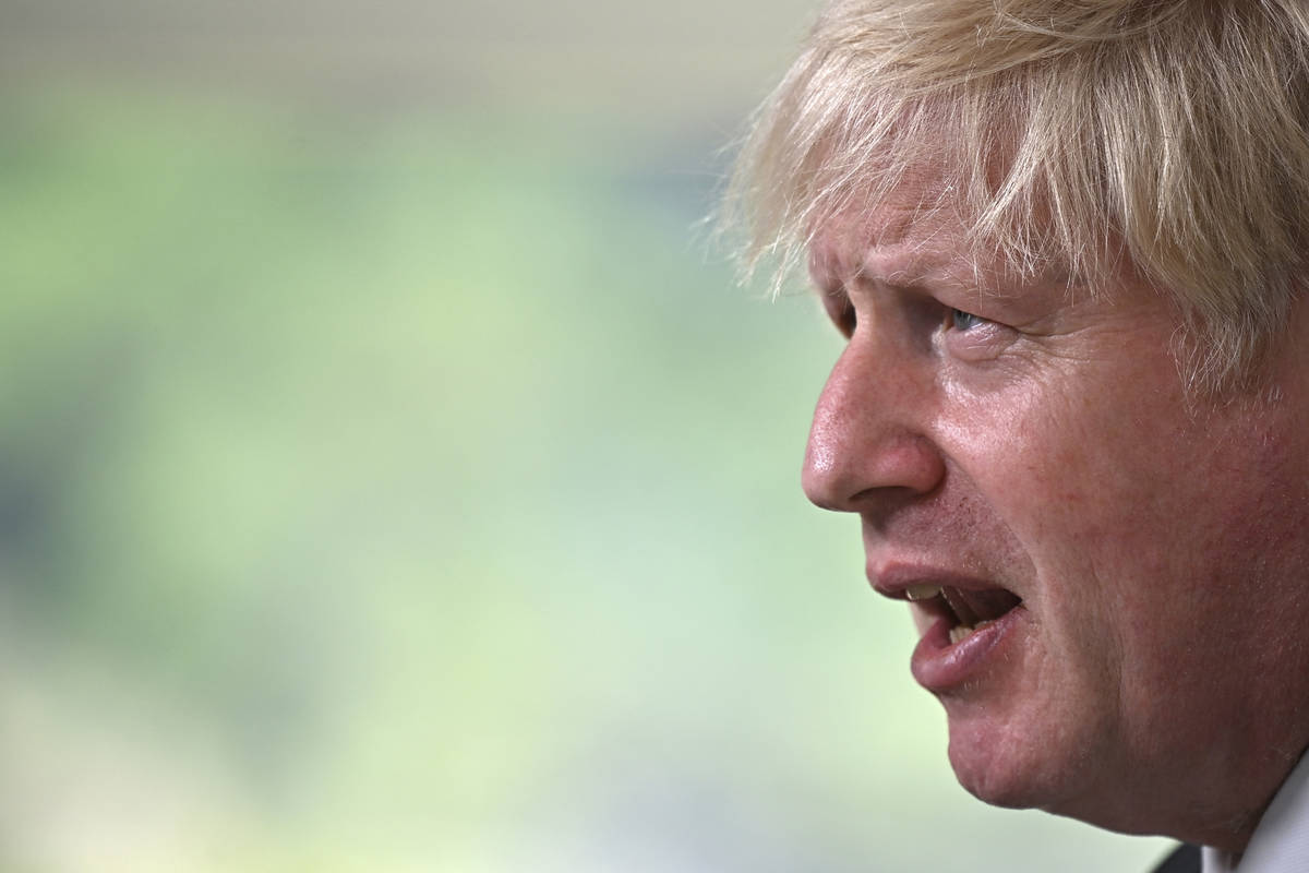 Britain's Prime Minister Boris Johnson speaks, during a press conference on the final day of th ...