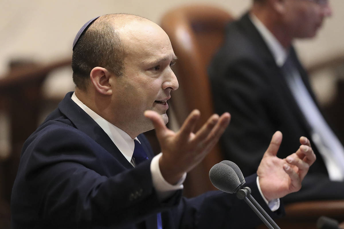 Israel's designated new prime minister, Naftali Bennett speaks during a Knesset session in Jeru ...