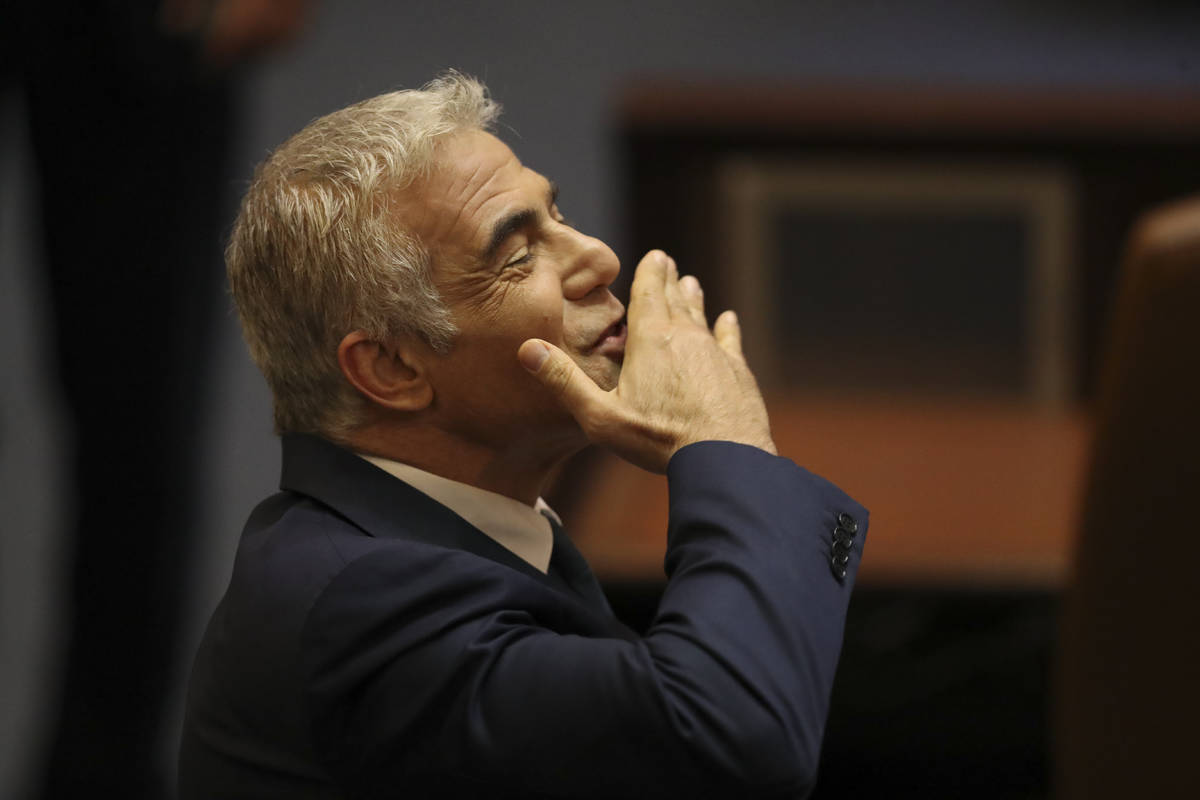 Israeli politician Yair Lapid of the Yesh Atid party sends greetings during a Knesset session i ...