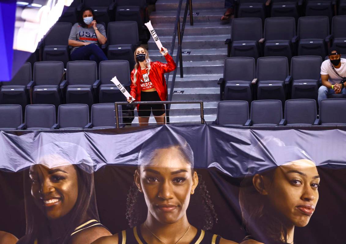 A member of the Las Vegas Aces Wild Card crew cheers during the second quarter of a WNBA basket ...