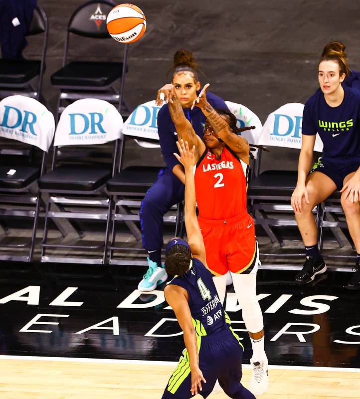 Las Vegas Aces' Riquna Williams (2) shoots over Dallas Wings' Moriah Jefferson (4) during the f ...