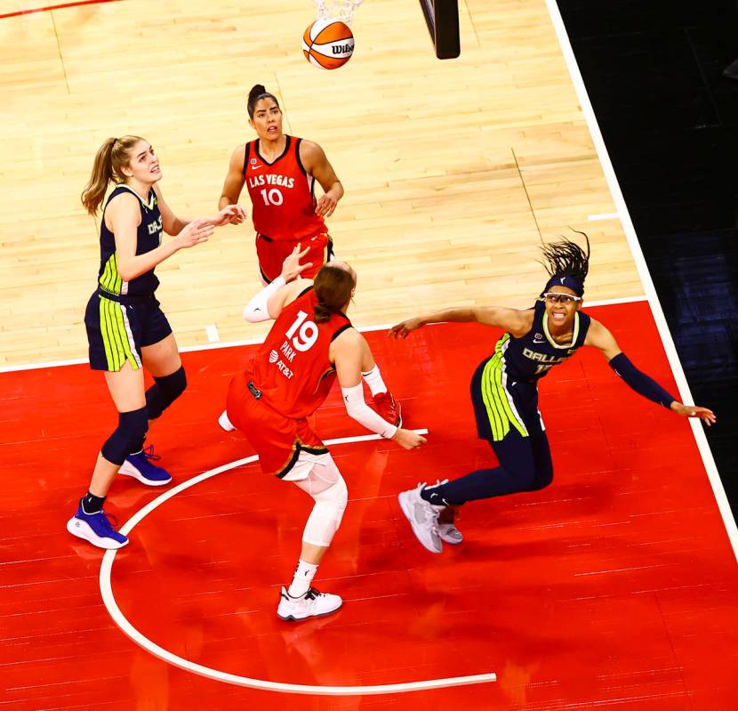 Dallas Wings’ Allisha Gray, right, watches her shot after getting fouled by Las Vegas Ac ...