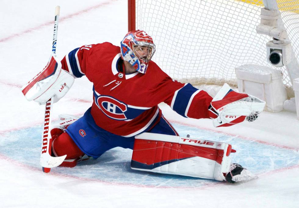 Carey Price makes a save during second period NHL Stanley Cup playoff hockey action against the ...