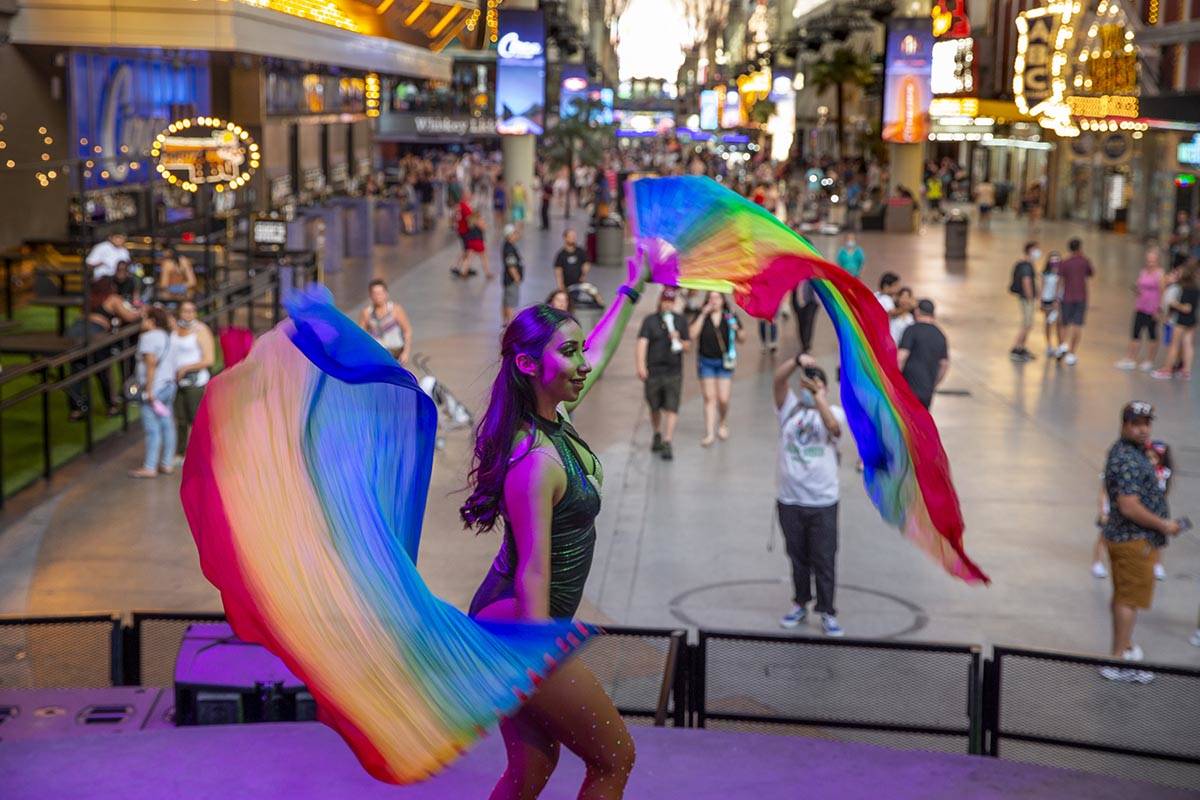 Dancing DJ July performs for visitors stopping by to watch her show at the Fremont Street Exper ...