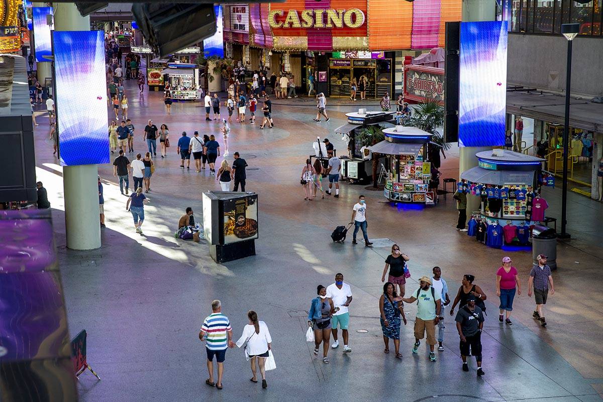 Visitors wander along the shops near the D Las Vegas at the Fremont Street Experience on Monday ...