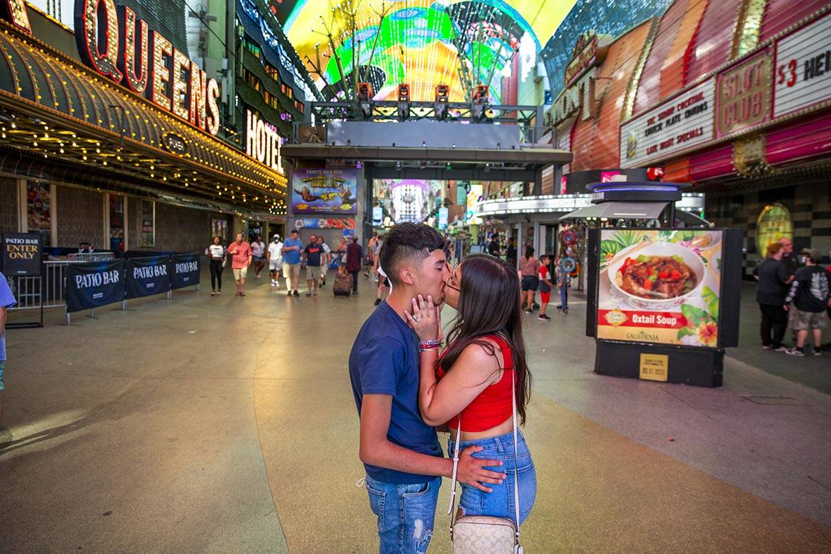 Gilbert Gomez, left, and Itzel Noriega of Tucson, Arizona, kiss beneath the canopy at the Fremo ...