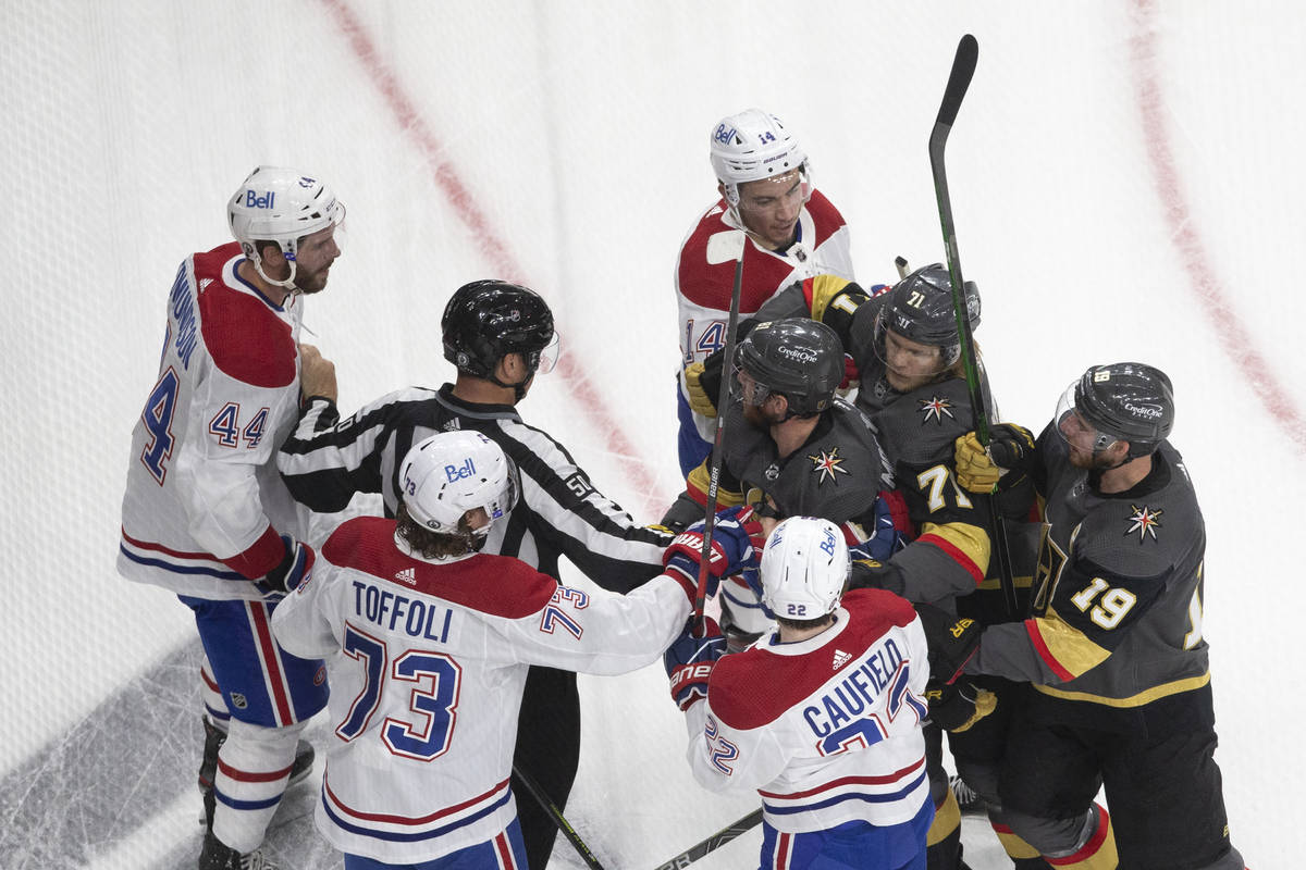 Players get into a scuffle, including Golden Knights defenseman Alex Pietrangelo (7) and Canadi ...