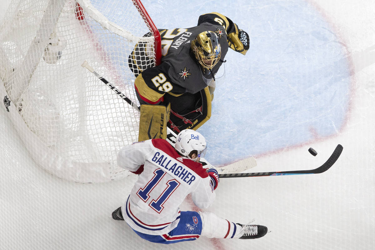Canadiens right wing Brendan Gallagher (11) unsuccessfully attempts a shot on Golden Knights go ...