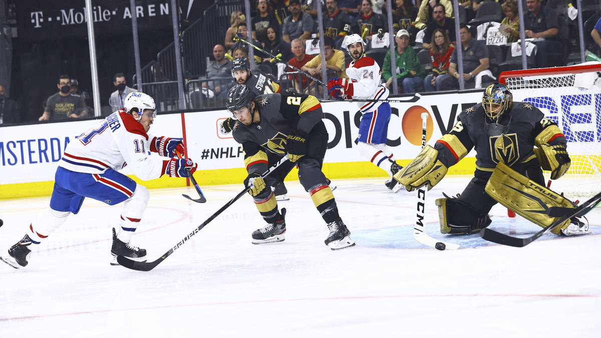 Golden Knights goaltender Marc-Andre Fleury (29) blocks the puck in front of defenseman Zach Wh ...