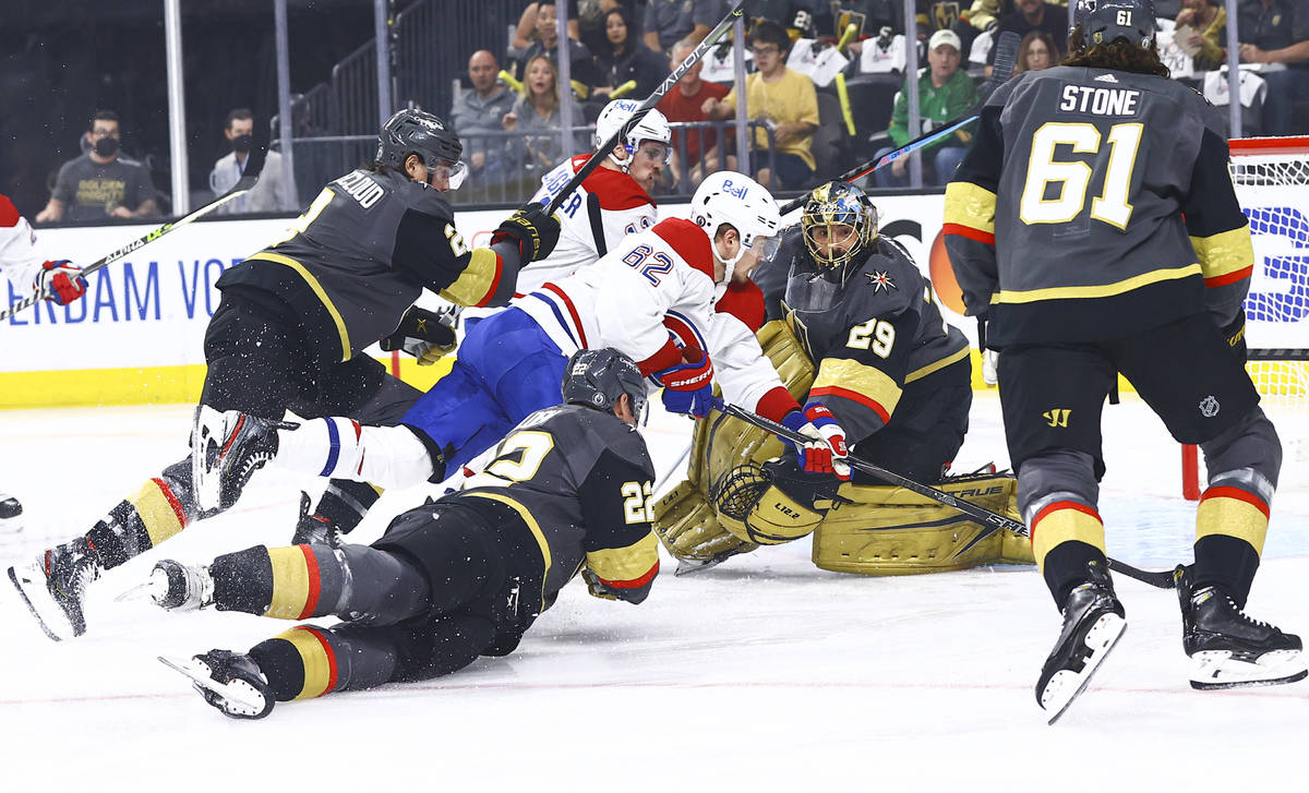 Golden Knights goaltender Marc-Andre Fleury (29) stops the puck in front of Montreal Canadiens' ...