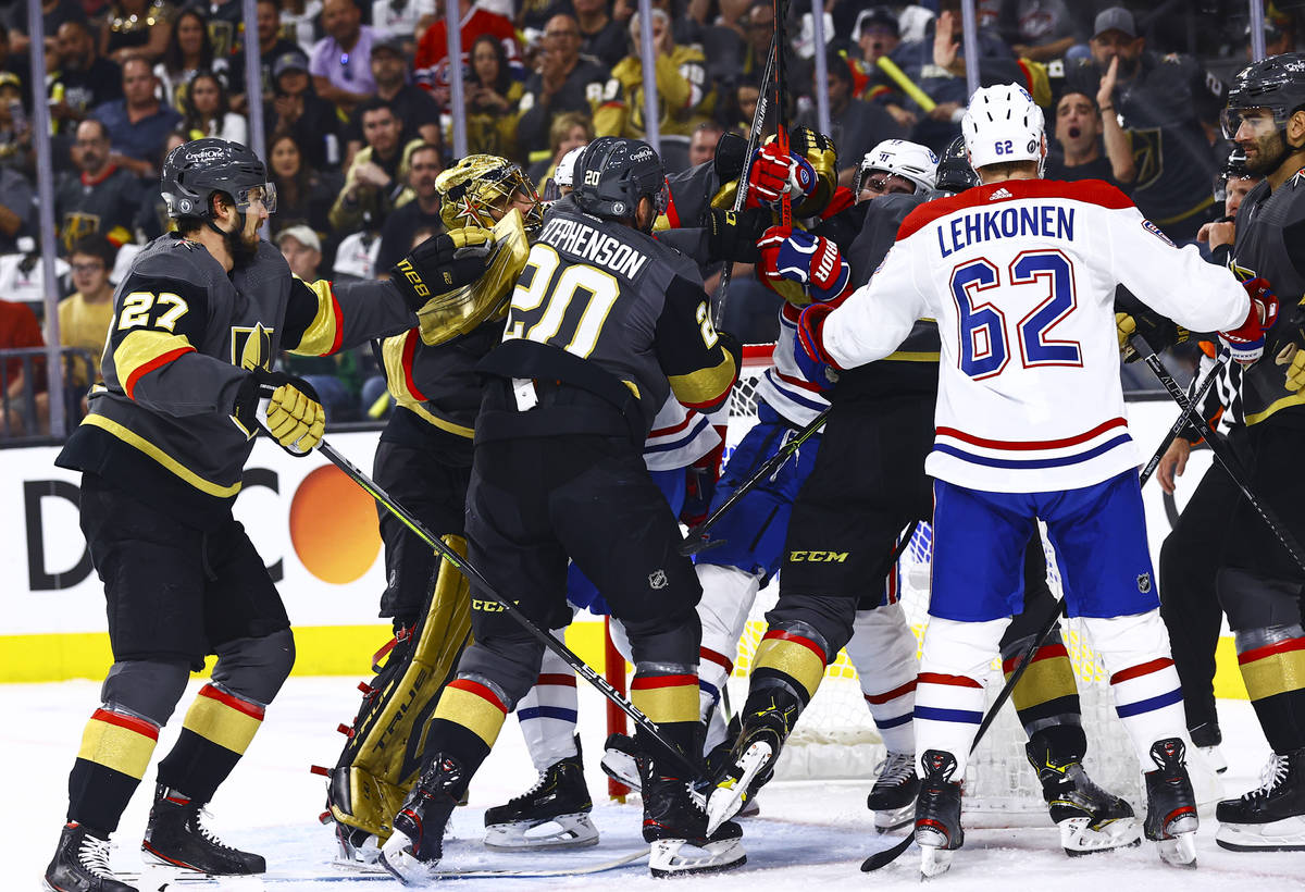 Golden Knights players fight the Montreal Canadiens during the first period of Game 1 of an NHL ...