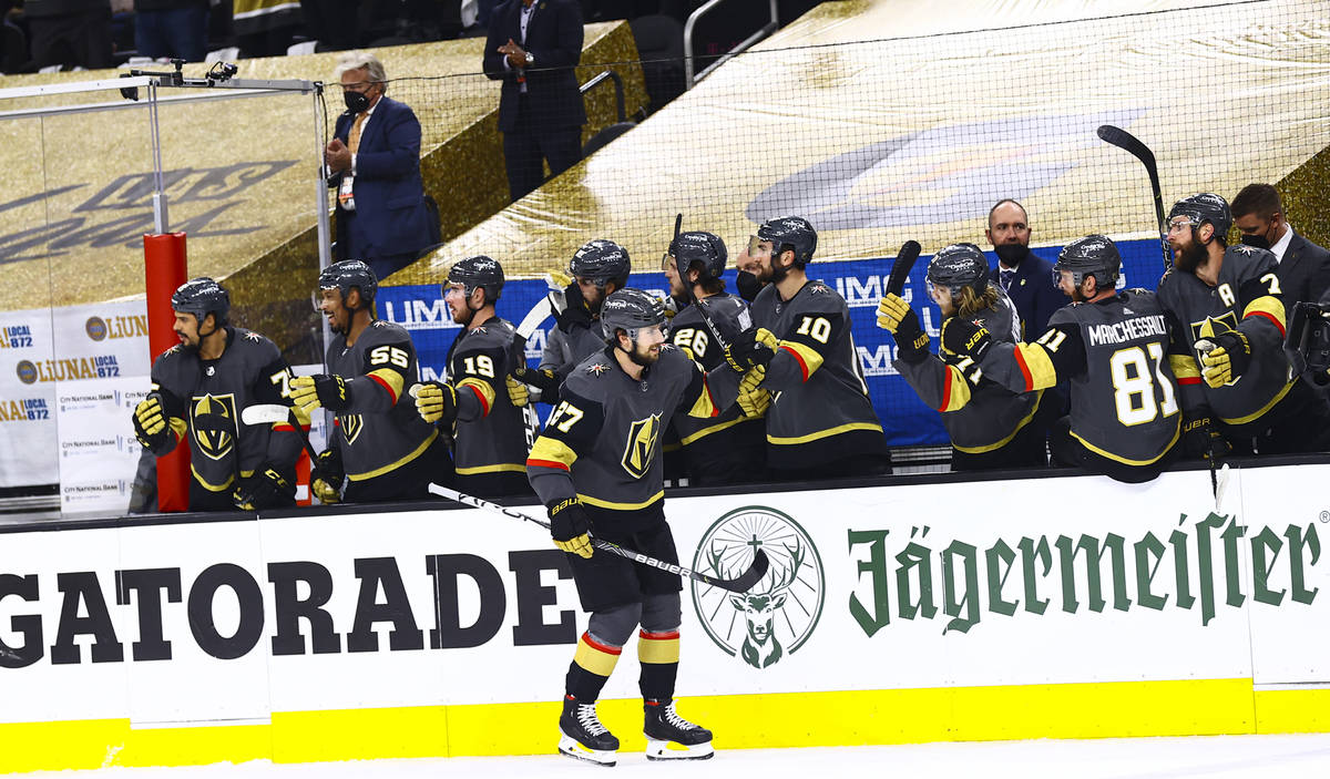 Golden Knights’ Shea Theodore (27) celebrates after scoring against the Montreal Canadie ...