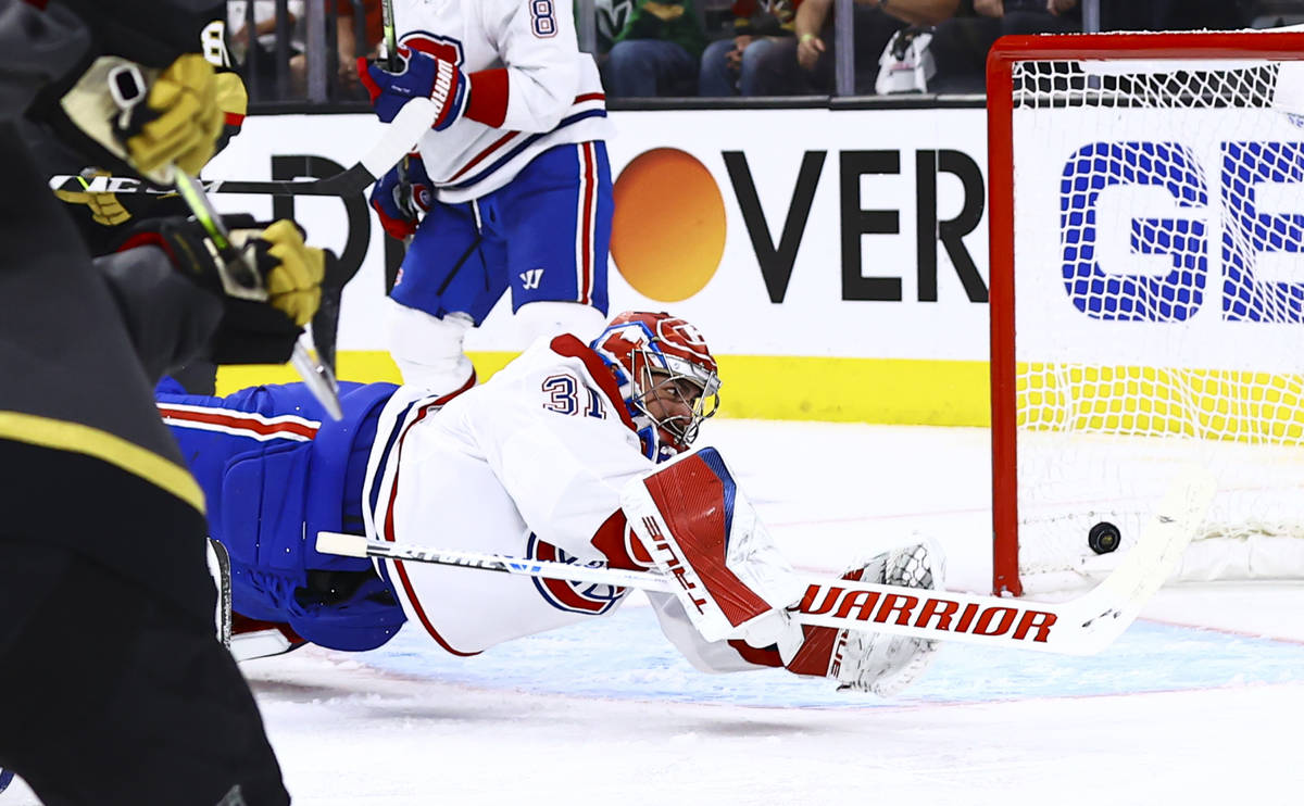 Golden Knights’ Alec Martinez (23) scores a goal past Montreal Canadiens goaltender Care ...