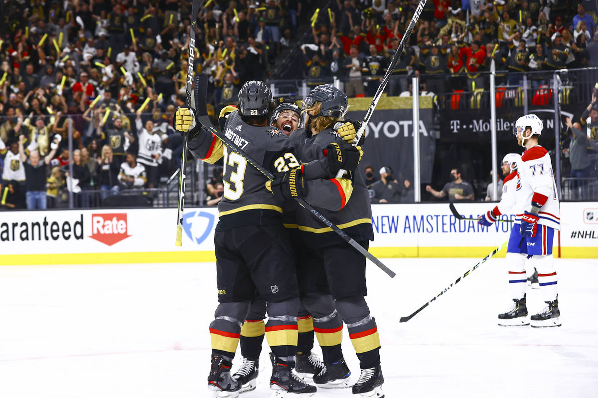Golden Knights’ Alec Martinez, left, celebrates his goal with Jonathan Marchessault, cen ...