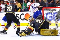 Golden Knights goaltender Marc-Andre Fleury (29) stops the puck in front of Montreal Canadiens' ...