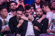 Dario Sammartino, middle, from Italy, celebrates with fans after advancing to the final two pla ...