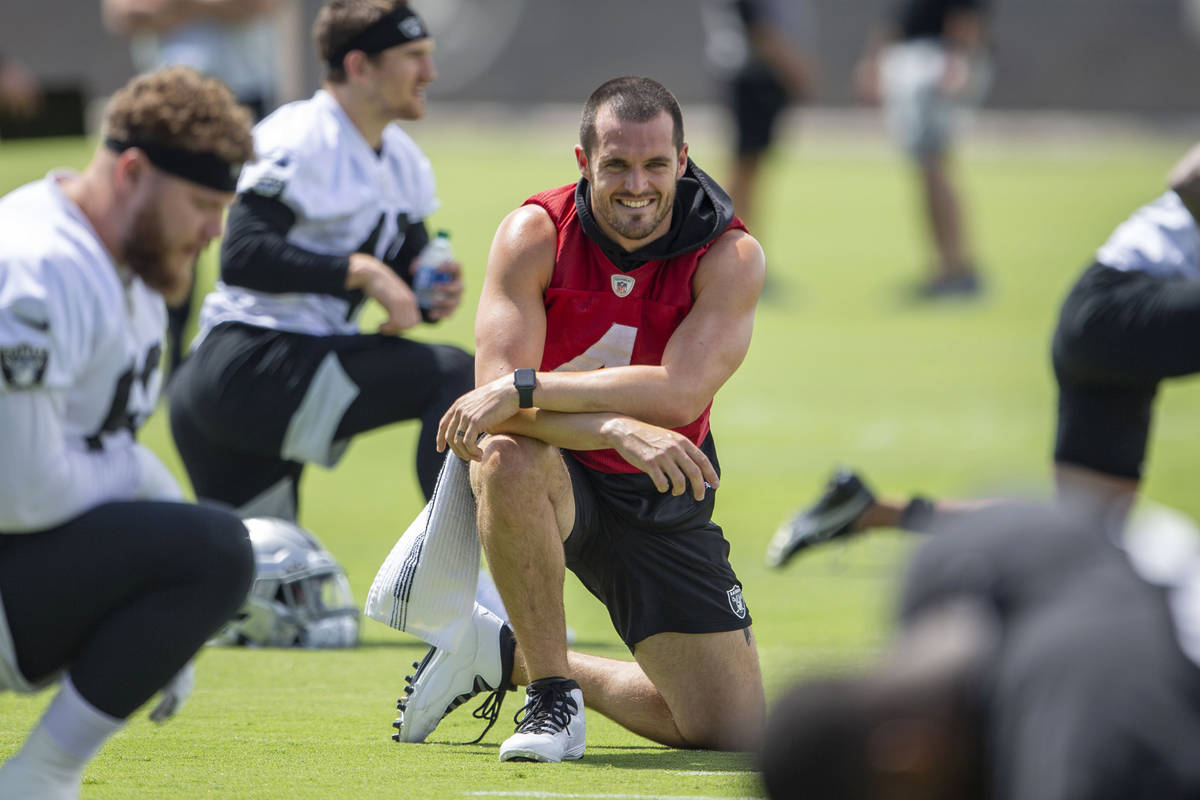 Raiders quarterback Derek Carr (4) stretches during their NFL football practice on Wednesday, J ...