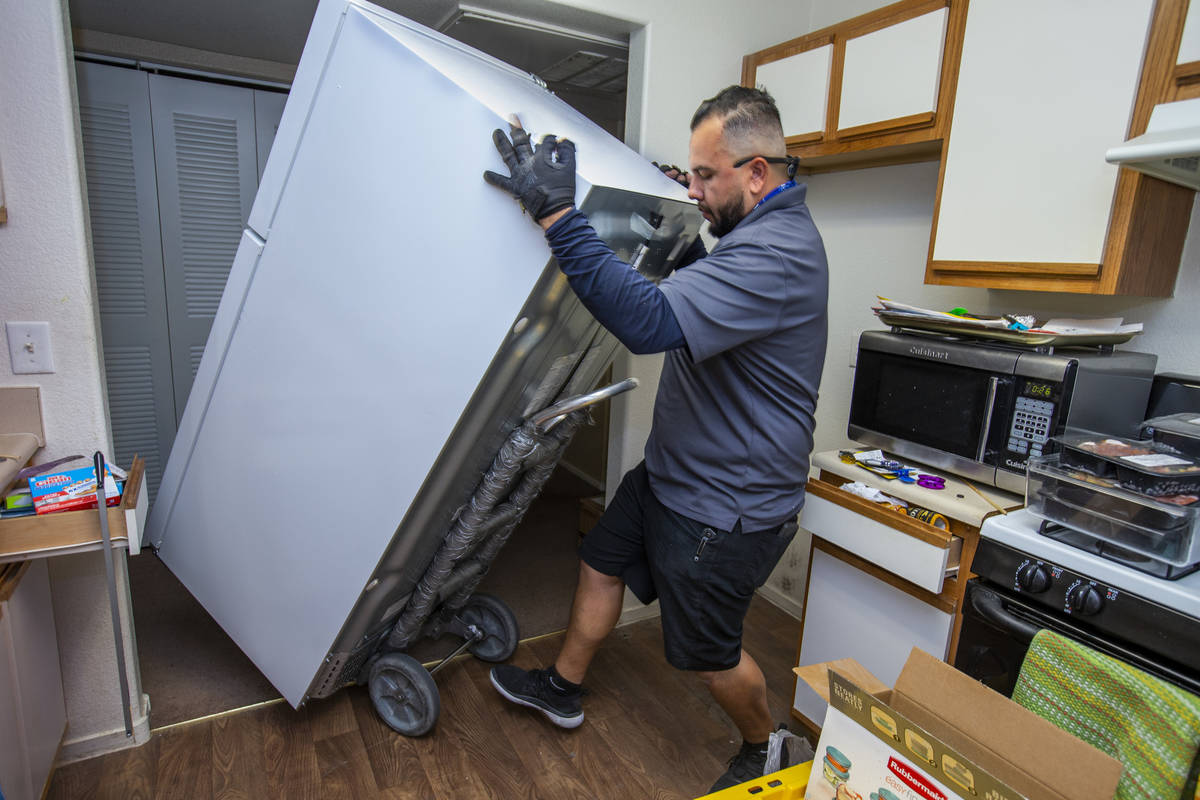 Lowe's employee Albert Vazquez delivers one of the 98 fridges at Bonanza Pines Senior Living be ...
