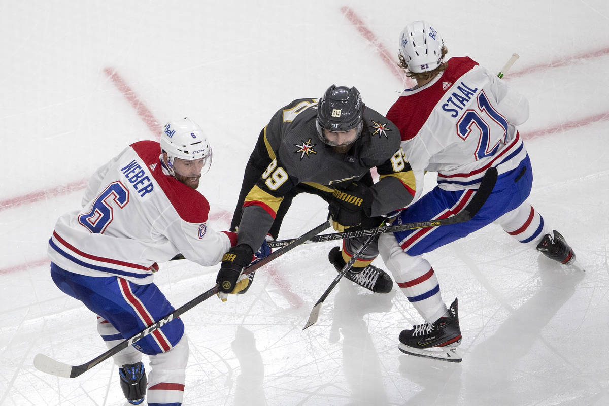 Canadiens defenseman Shea Weber (6) and center Eric Staal (21) block Golden Knights right wing ...