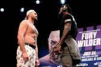 Tyson Fury, left and Deontay Wilder face off at a news conference in Los Angeles on Tuesday, Ju ...