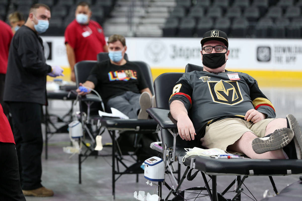 Zach Mueller of Las Vegas participates during a blood donation drive hosted by the American Red ...