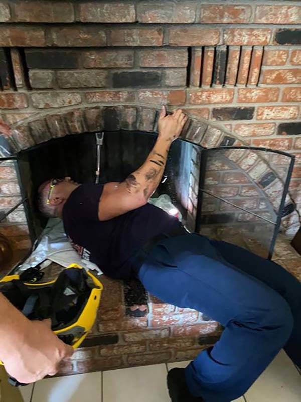 Henderson firefighters rescue an 18-year-old woman from the chimney of a home near Horizon Driv ...