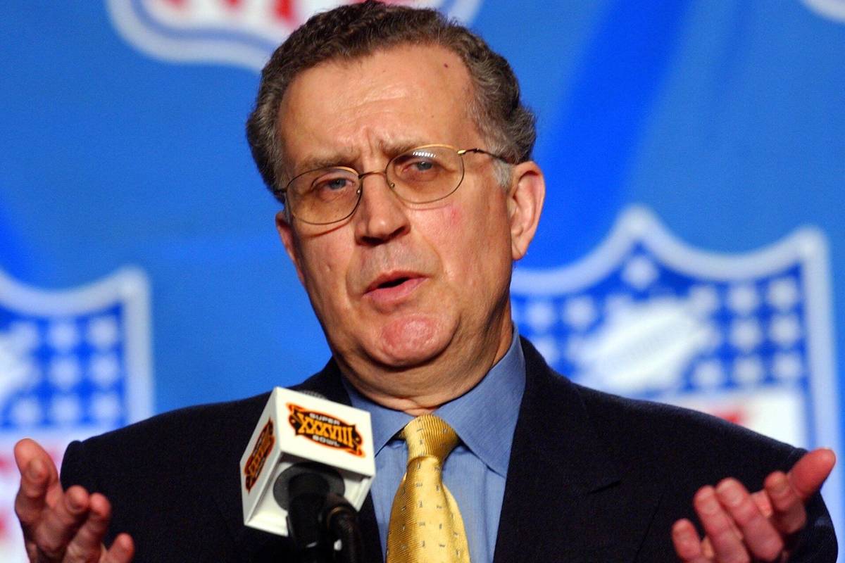 National Football League Commissioner Paul Tagliabue talks with reporters during a news confere ...