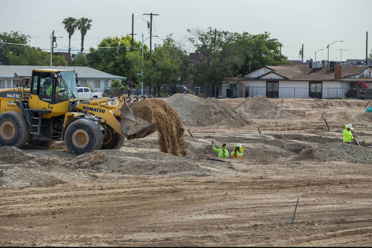 A construction crew begins work on Arcadia by Harmony Homes off of Rancho Drive on Wednesday, J ...