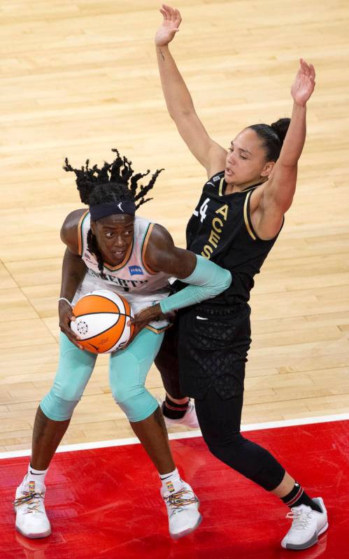 Las Vegas Aces guard Destiny Slocum (24) guards New York Liberty guard Jazmine Jones (4) during ...