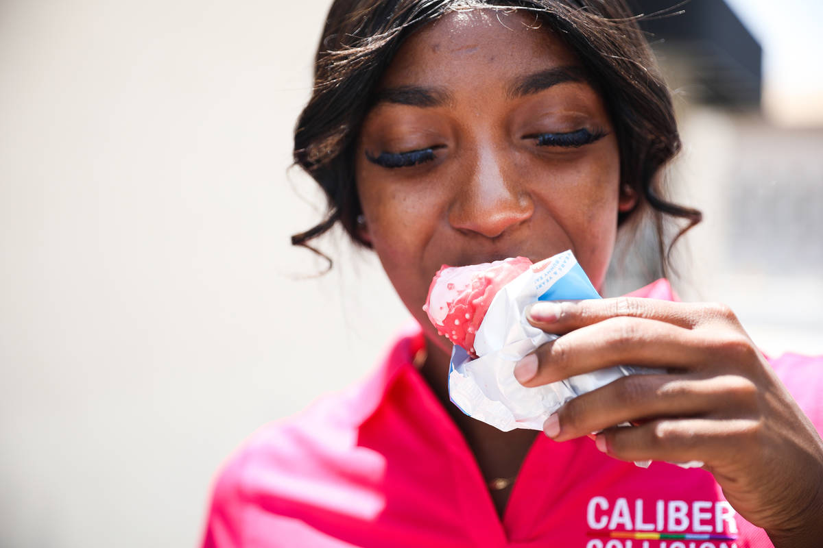 Jazmine Eady eats ice cream outside Caliber Collision in Las Vegas Wednesday, June 16, 2021. (R ...