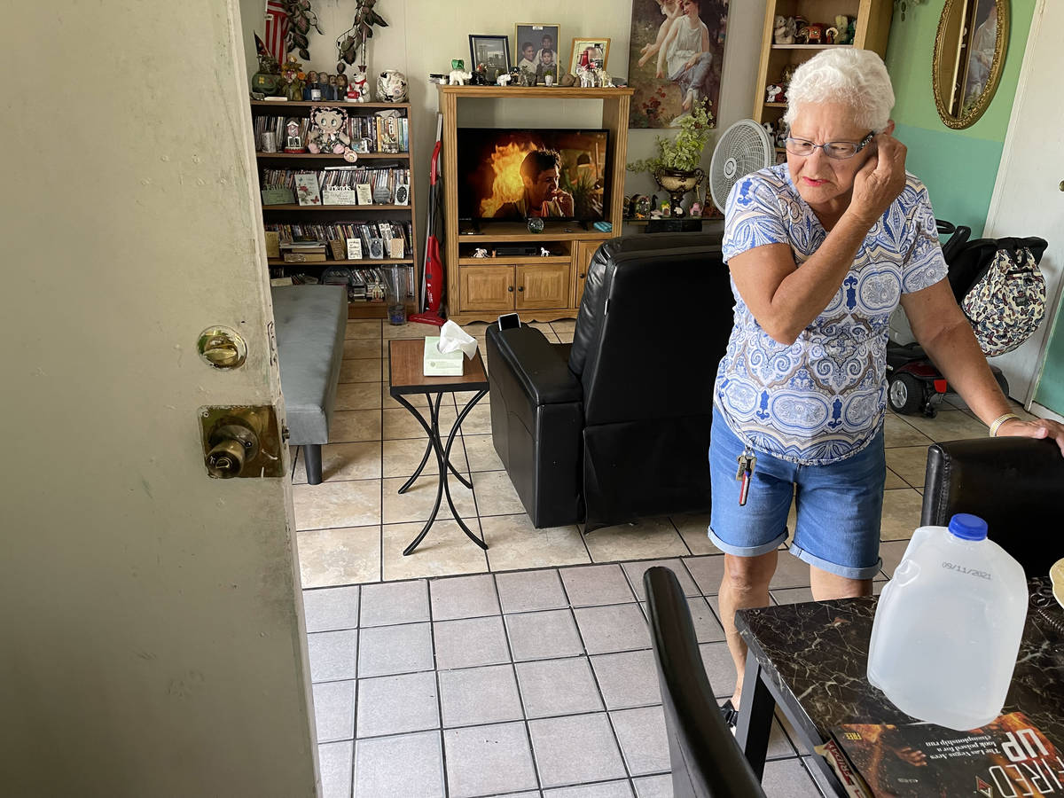 Carmen Millan, 82, uses a fan with open windows and door to keep cool at her apartment on East ...