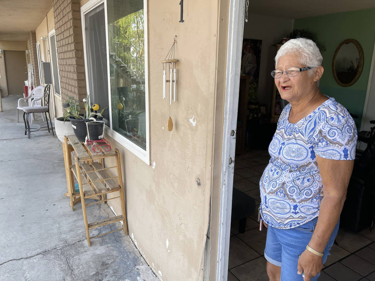 Carmen Millan, 82, uses a fan with open windows and door to keep cool at her apartment on East ...