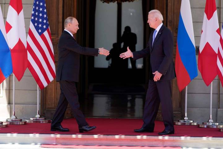 President Joe Biden and Russian President Vladimir Putin, arrive to meet at the 'Villa la Grang ...