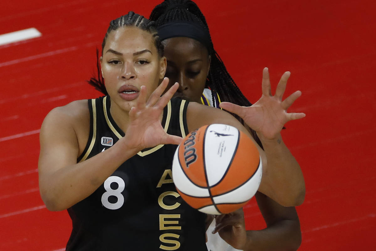 Las Vegas Aces center Liz Cambage (8) receives a ball against Los Angeles Sparks forward/center ...