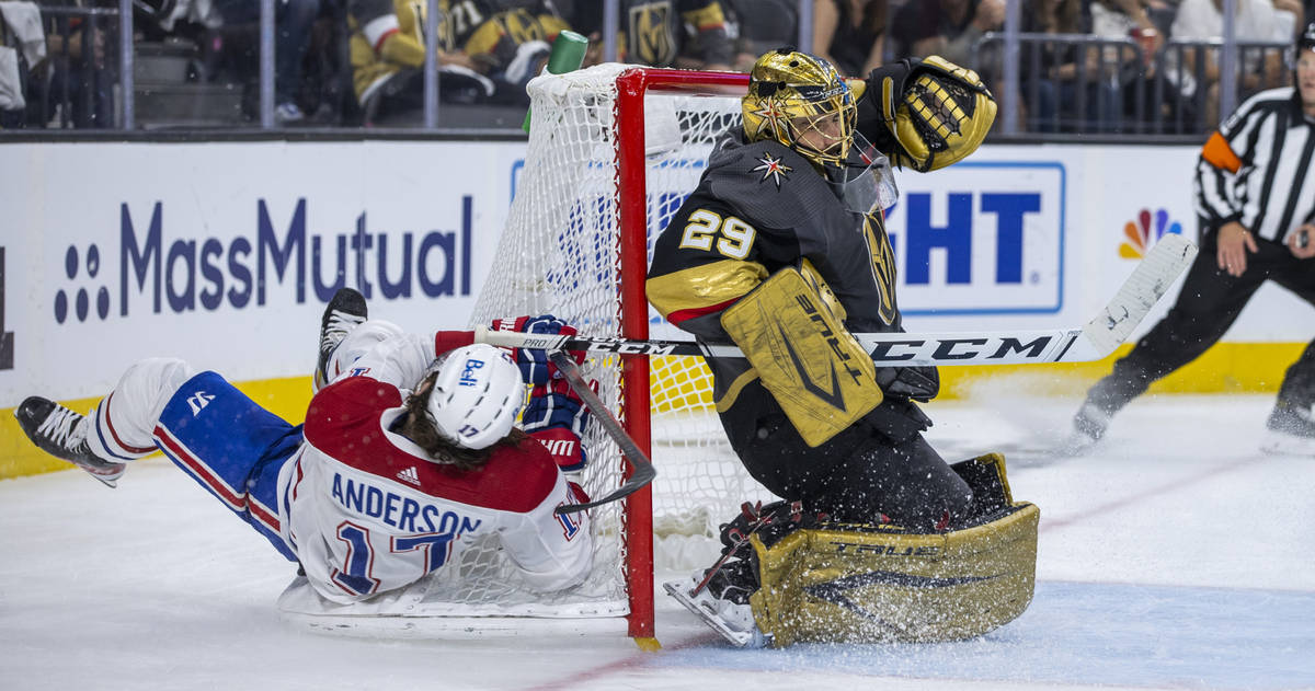 Golden Knights goaltender Marc-Andre Fleury (29) defends the net from Montreal Canadiens right ...