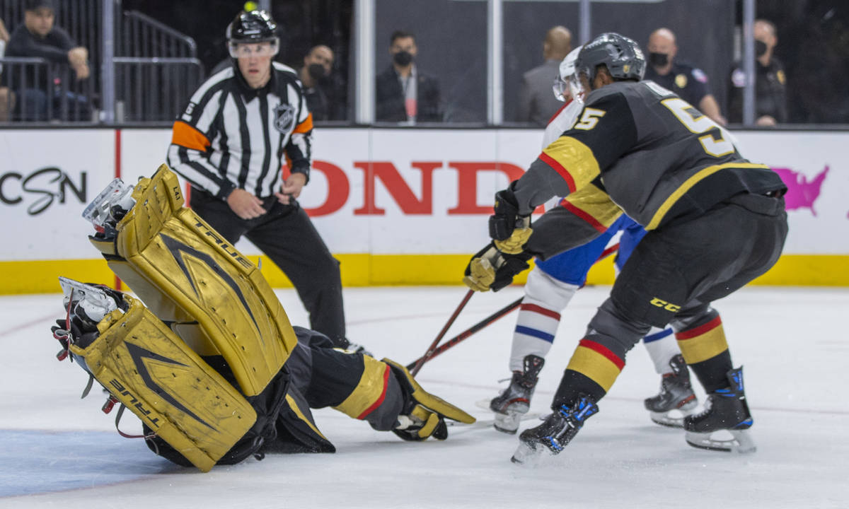 Golden Knights goaltender Marc-Andre Fleury (29) dives to try and stop a shot on goal versus th ...