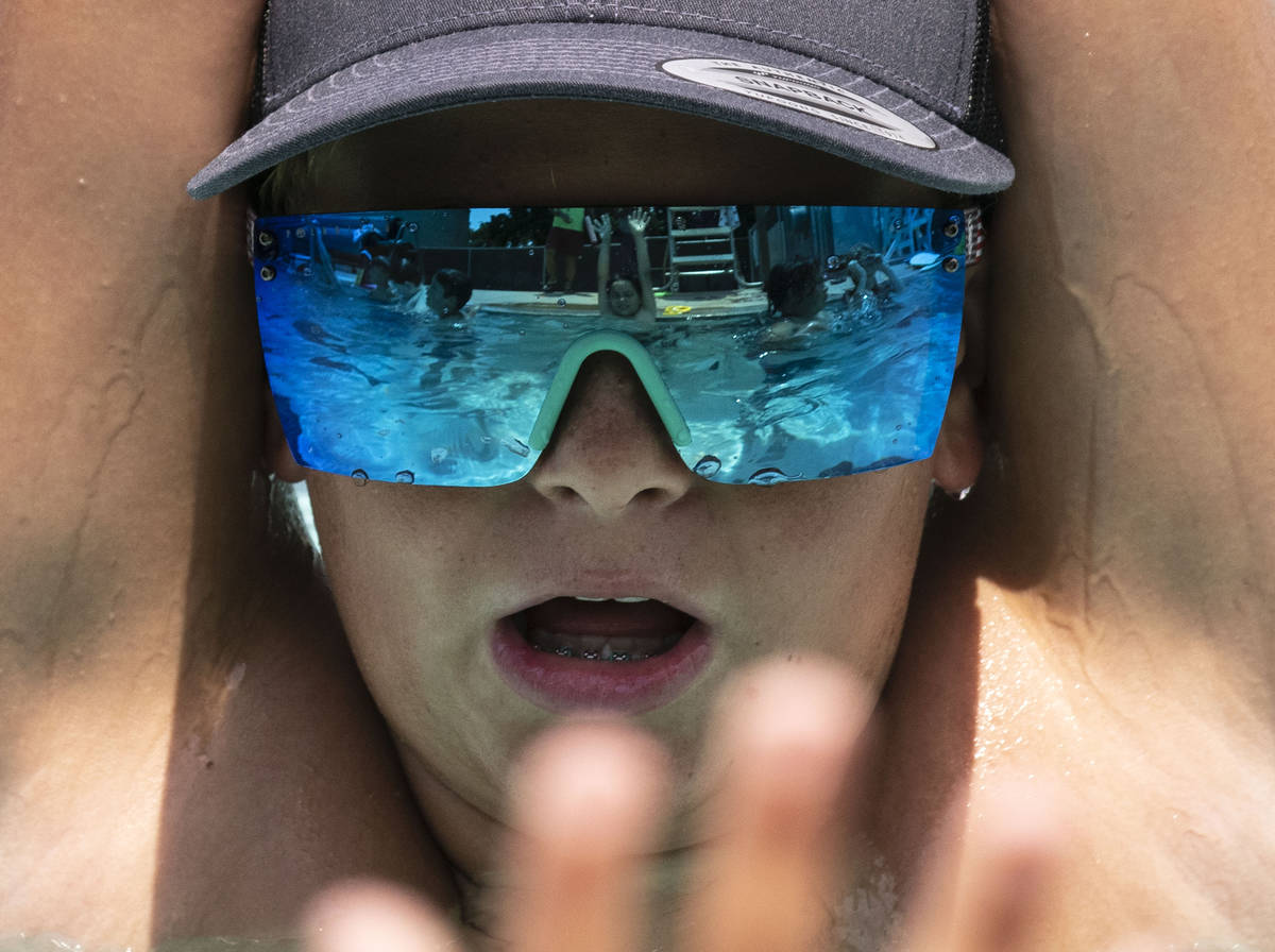 Cruz Stevens, 12, stretches during the 12th annual World’s Largest Swimming Lesson at Bo ...