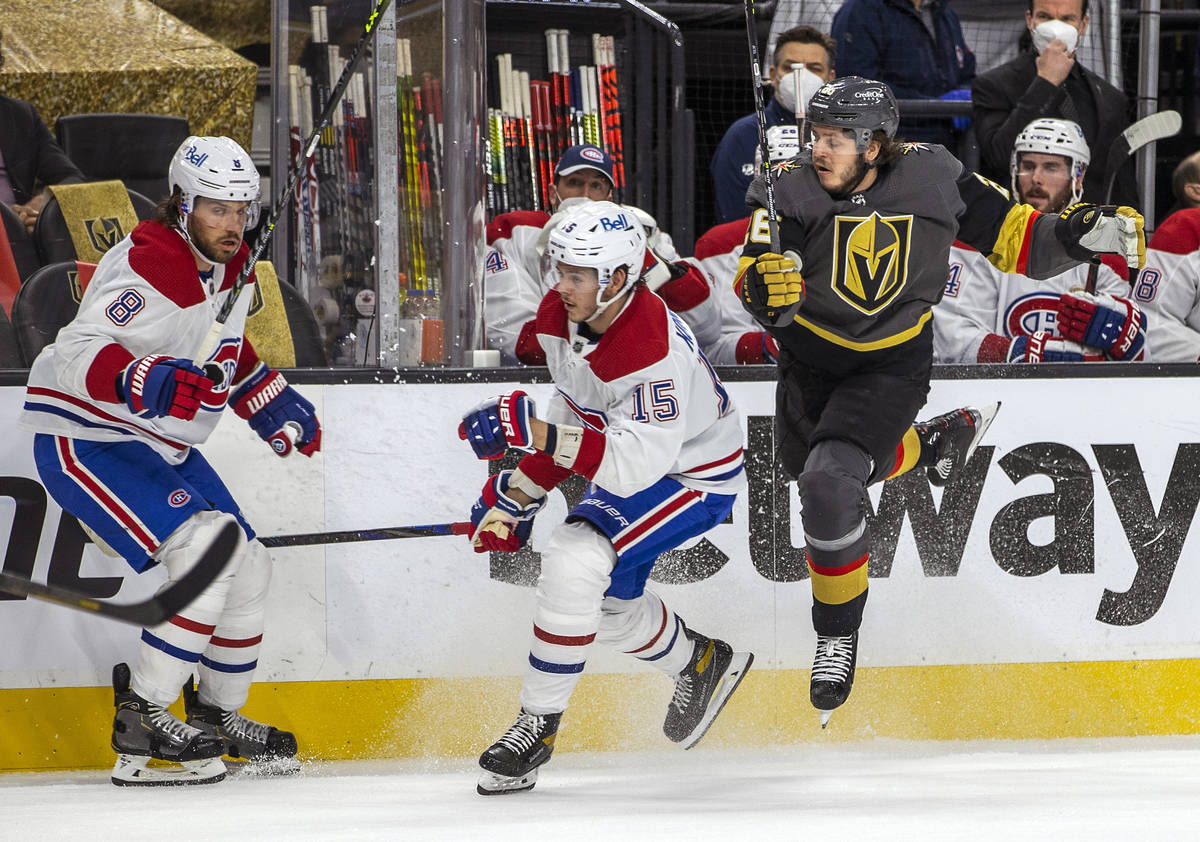 Golden Knights center Mattias Janmark (26) catches some air while avoiding Montreal Canadiens c ...