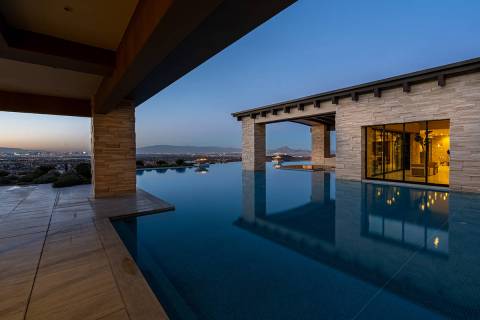 The pool surrounds the home. (Sun West Luxury Realty)