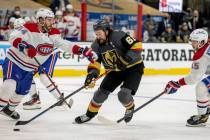 Golden Knights right wing Mark Stone (61) battles for control of the puck with Montreal Canadie ...