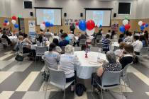 Attendees listen to speeches at the World Refugee Day event hosted by Catholic Charities of Sou ...