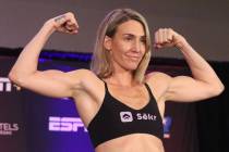 Mikaela Mayer poses on the scale during a weigh-in event at the Virgin Hotel Las Vegas, Friday, ...