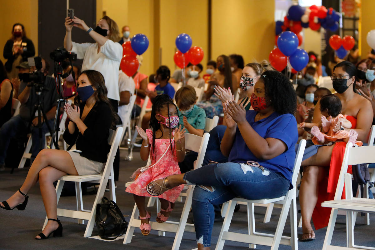 Attendees applaud during a Juneteenth celebration at the Discovery Childrenճ Museum in La ...