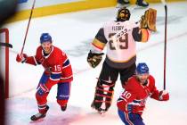 Montreal Canadiens' Jesperi Kotkaniemi, left, and Joel Armia celebrate a goal by Josh Anderson ...