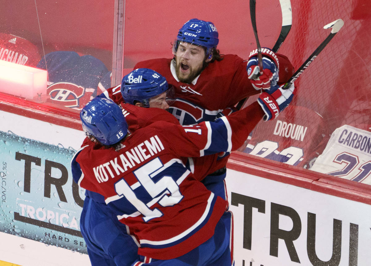 Montreal Canadiens' Josh Anderson celebrates with Paul Byron and Jesperi Kotkaniemi after scori ...